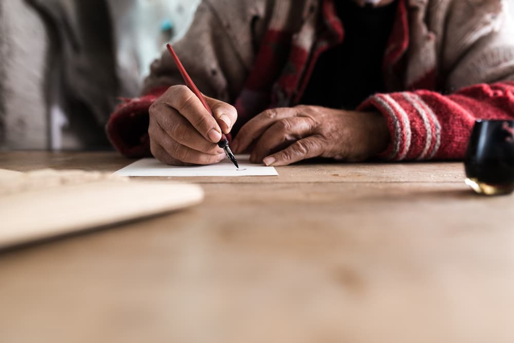 grandparent writing letter to grandkid